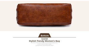 Detailed view of the flat bottom and neat stitching on a brown leather tote bag
