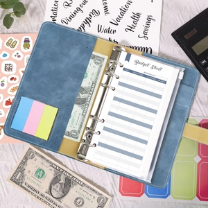 Blue A6 PU leather budget binder detail with 6-ring clips and printed budget sheets