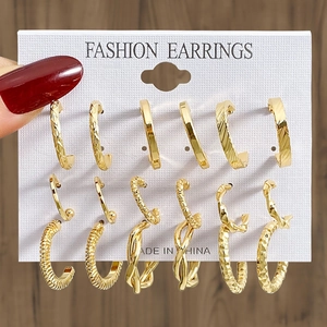 16-piece vintage gold earring set with pearls and textured hoops on a card