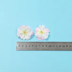 Artificial plum blossoms with pink gradient petals and ruler showing 4cm diameter size
