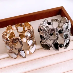 Vintage irregular textured bangle in gold and silver finish with beaded edge detail