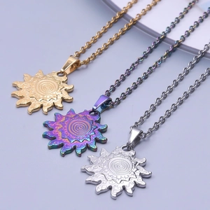 Detailed view of sun-shaped pendants in gold, silver, and rainbow steel with spiral texture