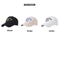 Three distressed baseball caps in black, beige, and white with frayed brim embroidery