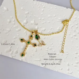 18K gold plated copper necklace with cross and tulip pendants featuring green cubic zirconia