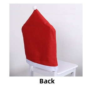 Detail view showing back of red Santa hat chair cover with white pompom and plush trim