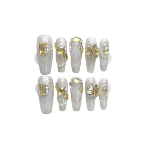 Luxurious handmade long coffin press-on nails with pearl white base and gold crystals
