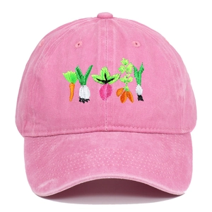 Close-up of colorful vegetable embroidery on pink washed cotton baseball cap