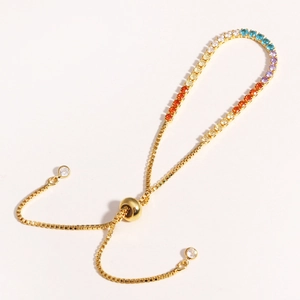 Adjustable gold bracelet with multi-colored rainbow cubic zirconia in a single row