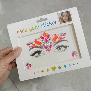 Detailed view of colorful face gem stickers featuring teardrop and round rhinestone shapes
