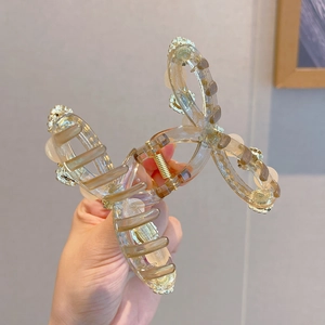 Elegant champagne butterfly hair claw clip with crystal rhinestones on clear acrylic