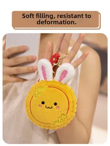 Detail of cute yellow rabbit mooncake plush keychain with soft stuffing and metal clasp
