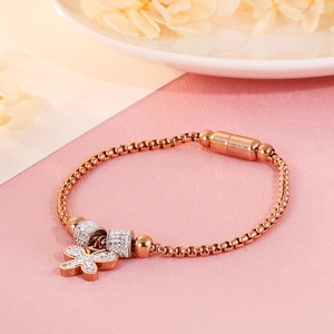 Detail of rose gold butterfly bracelet with crystal pavé and magnetic clasp closure