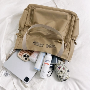 Spacious khaki nylon tote bag with drawstring closure for daily commuting and school