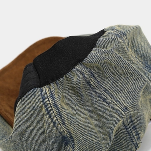 Detailed close-up of premium denim texture and black elastic band on the retro beret cap