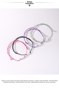 Detail of adjustable woven bracelets in pink, black, purple, and grey with silver beads