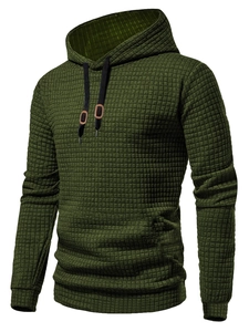 Close-up of army green hoodie featuring waffle knit texture and black drawstrings
