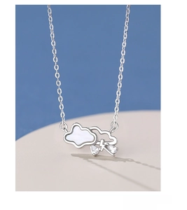 Close-up of S999 silver necklace with shell cloud, lightning and sparkling rain drops