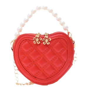 Red heart-shaped girls handbag with pearl handle and golden chain strap for crossbody wear