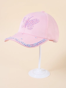 Detail of pink baseball cap with rhinestone butterfly and iridescent gems on the brim