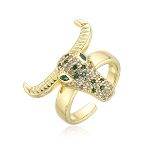 Hip hop style bull head ring in gold finish with green cubic zirconia micro-inlays