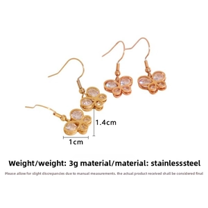 Detail of rose gold butterfly earrings in stainless steel with zircon weight 3g