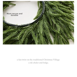 Detail of Norfolk pine garland showing secure needle weaving on a sturdy black frame