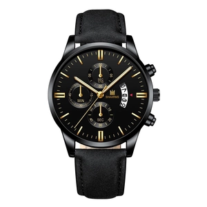 Detailed close-up of the black chronograph watch dial with golden markers and calendar window
