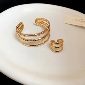 Three-layer gold bamboo-style open bracelet and ring set for women in minimalist design