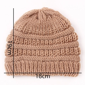 Detailed knit texture and dimensions of the camel beige winter beanie for infants
