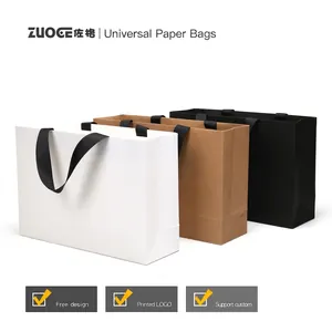 Customizable minimalist paper gift bags with ribbon handles in white, kraft, and black