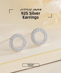 Detailed close-up of S925 sterling silver hollow hoop earrings with paved white zircons