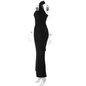 Detail of black strapless evening dress with elegant draping and floor-length hem