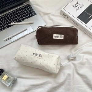 Polka dot wool pencil case for stationery storage with minimalist aesthetic design