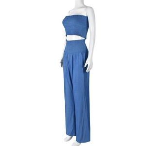 Detail of blue two-piece set featuring ruched bandeau top and flowy wide-leg pants