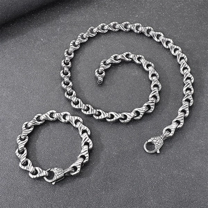 Detailed view of punk style interlocking stainless steel chain links with vintage silver finish