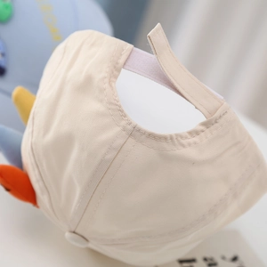 Kids dinosaur baseball cap in beige cotton featuring colorful 3D fins and velcro strap