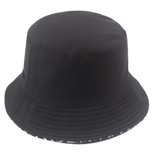 Double-sided sun hat with black exterior and leopard print lining, casual bucket hat style