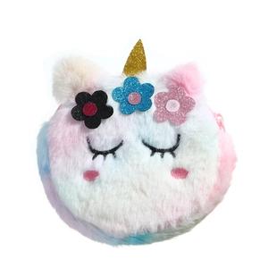 Detail of plush unicorn purse featuring gradient fur, glitter horn and sequin flowers