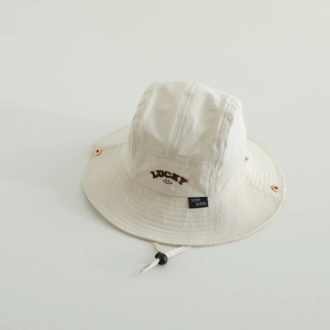 Detailed view of beige toddler sun hat with lucky embroidery and adjustable windproof cord