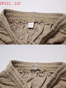 Dettaglio dell'elastico in vita e dell'etichetta sui pantaloncini in velluto a coste