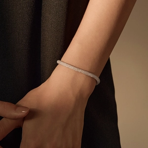 Elegant 925 sterling silver woven mesh bracelet with sparkling crystals on wrist