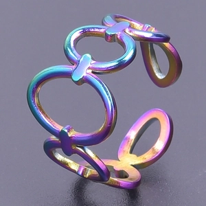 Detail of rainbow iridescent stainless steel interlocking rings with chain-like structure