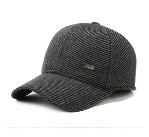Detail of the silver metal S SPORT CLASSIC emblem on a grey wool baseball cap