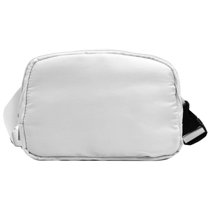 Detail view of the durable white fabric texture and black plastic buckle on the waist bag