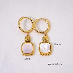 Detail showing 19mm length and 12mm width of vintage gold square shell hoop earrings