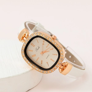 Women's rose gold quartz watch with a diamond bezel and a textured white leather strap