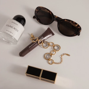 Flat lay of two-tone gold and silver chain bracelet with lobster clasp and extensions