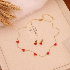 Detailed view of red heart necklace set with S925 stamp on a warm linen background