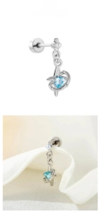 Detail of titanium steel earring with blue heart zircon, pearl and star charm accents