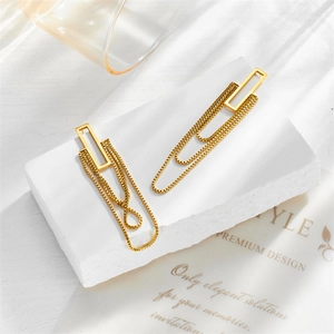 Elegant gold-plated geometric layered tassel chain drop earrings on a marble display